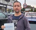 Oliver with Driving test pass certificate